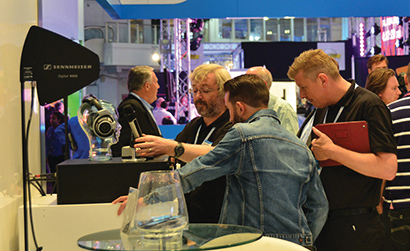 Andy Lillywhite of Sennheiser UK (center, in glasses) demos the new Digital 9000 wireless system. Watch the video on FOH-TV.