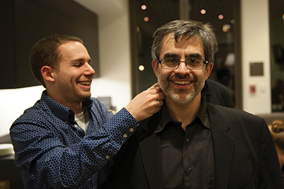 Scott Levine from CCRMA fits Cappella Romana artistic director Alexander Lingas with a Countryman B2D mic.