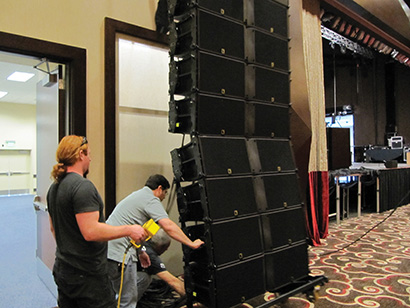 Preparing to fly the K2 rig (left to right) is Sound Image’s Chris Houston (holding motor controller), Dave Brooks from L-Acoustics and Sound Image’s Bob Delson.