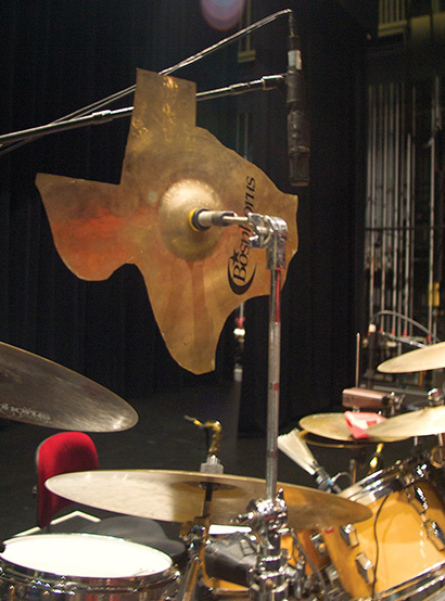 A Shure VP-88 stereo mic handles overheads, including this custom Texas-shaped crash cymbal.