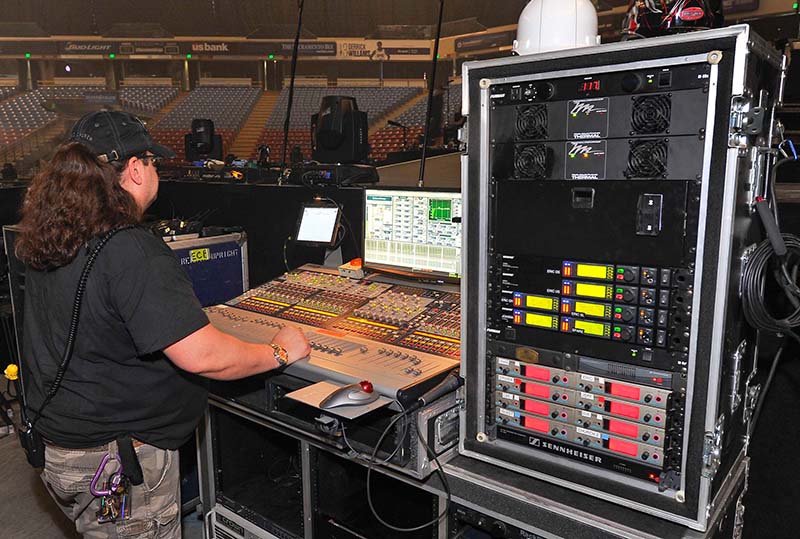 Monitor engineer Marc Earp runs a quick check on the Avid Profile after setup. Eric Church tour photo by Steve Jennings.