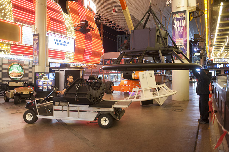 The crew gets ready to hang one of the custom overhead clusters above the Fremont Street Expereince.