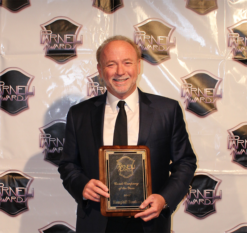 Joey Hemphill with the 2016 Parnelli Award for Coach Company of the Year.