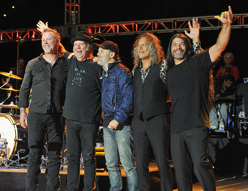 Metallica and Neil Young share the stage. Photo by Steve Jennings