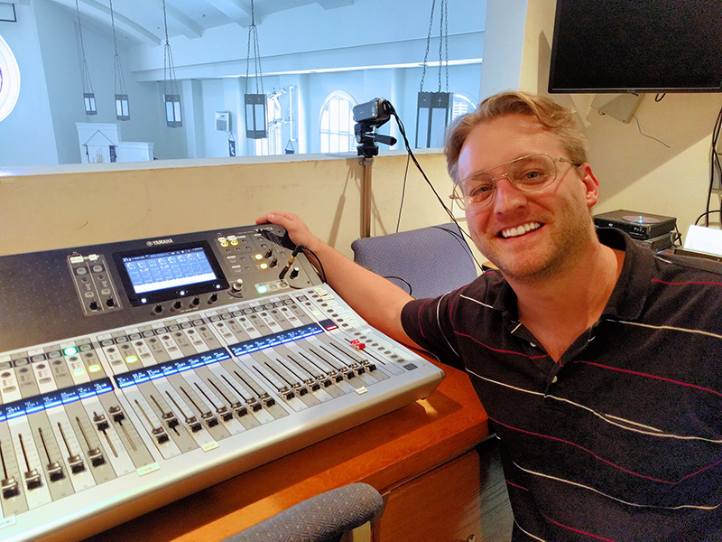 Worship director Gregory Case in the church’s sound booth, with the Yamaha TF5 console.