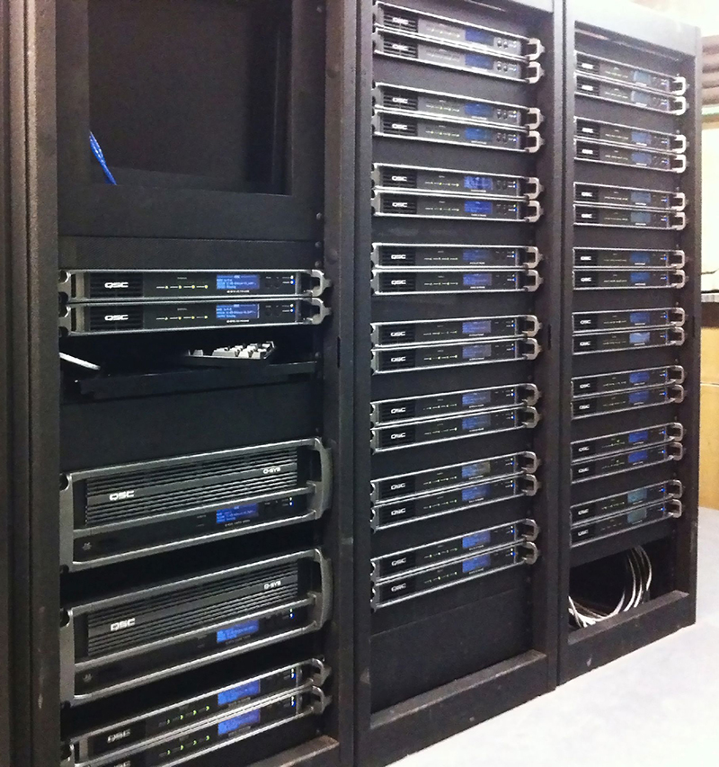 One of the facility’s QSC Q-SYS and amplifier racks.