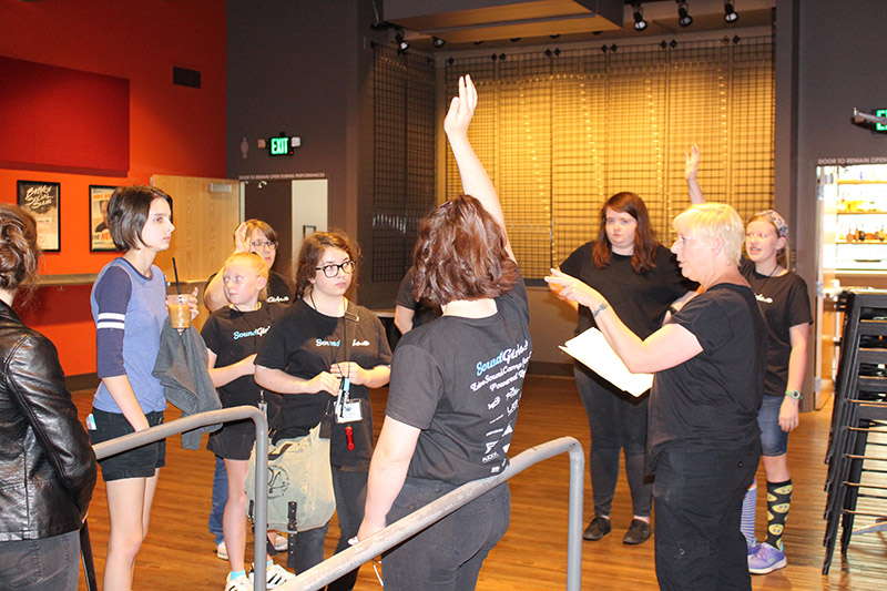 Karrie Keyes, second from right, preps campers for a show.