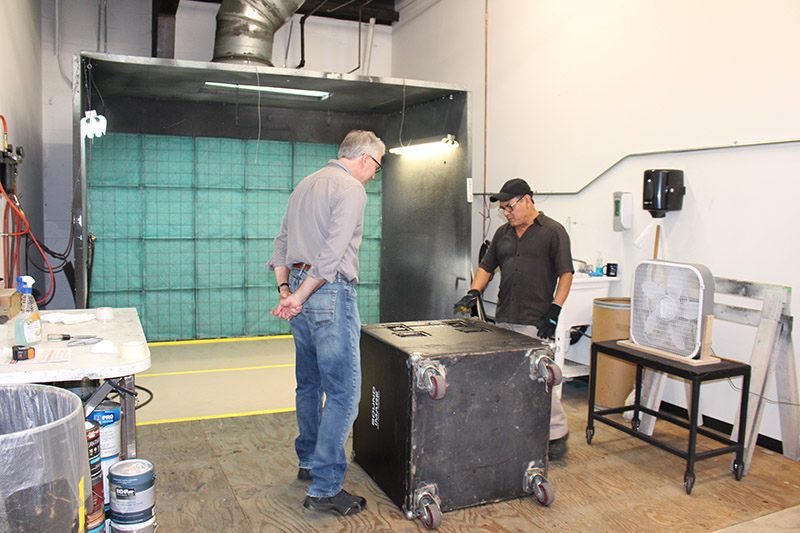 Joe Lamond in the paint shop with Tony Dominguez