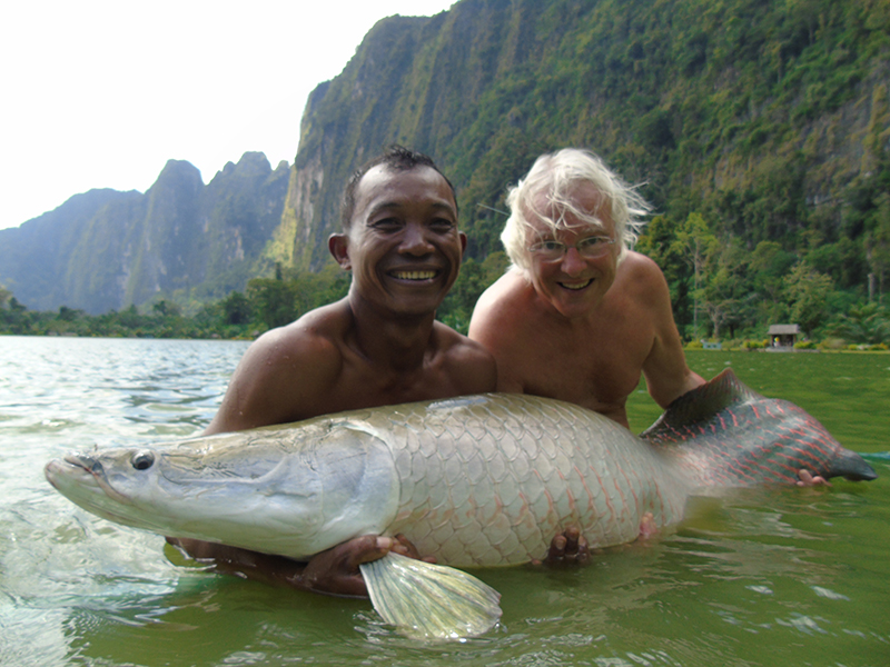 John catching one of the world’s largest fresh water fishes, an Amazon arapaima.