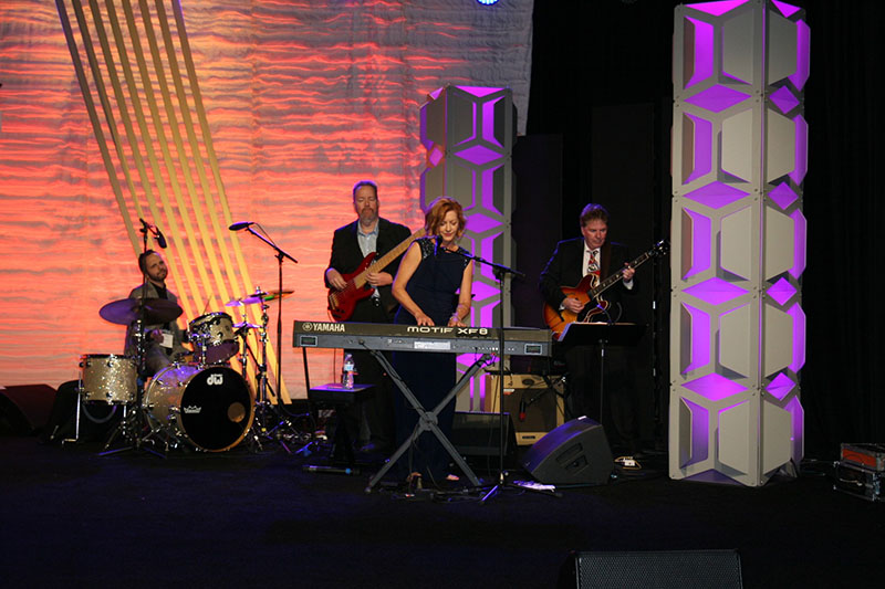 Kiki Ebsen and her band, including Grant Geissman on guitar, Steve Lawrence on bass and Matt Star on drums.