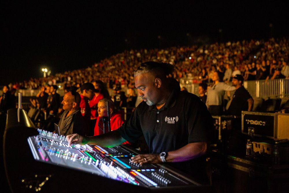 FOH Engineer Darcy Khan running Logic’s mix on one of the tour’s two SD7 consoles (photo credit: Debi Del Grande)