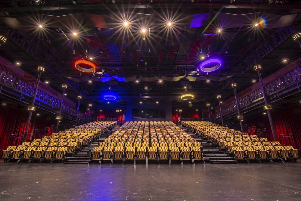 Situated at the confluence of the Chippewa and Eau Claire Rivers in Eau Claire, Wisconsin, the 143,000 square-foot space includes a 1,200-seat proscenium theater, the 400-seat JAMF black-box theater, five flexible rehearsal rooms & galleries, and a light, sound, and video production lab, among many other rooms.