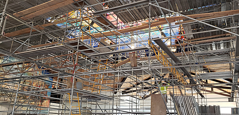 For long periods, the extensive construction scaffolding prevented access to the rafters for wiring and made in-progress acoustical measurements impossible