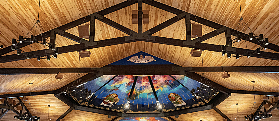 Detail of the main system, a majority of which are placed above the rafters for aesthetic reasons; however, there were some places where fill speakers had to hang slightly below the beams to provide even coverage for the altar and side transcepts