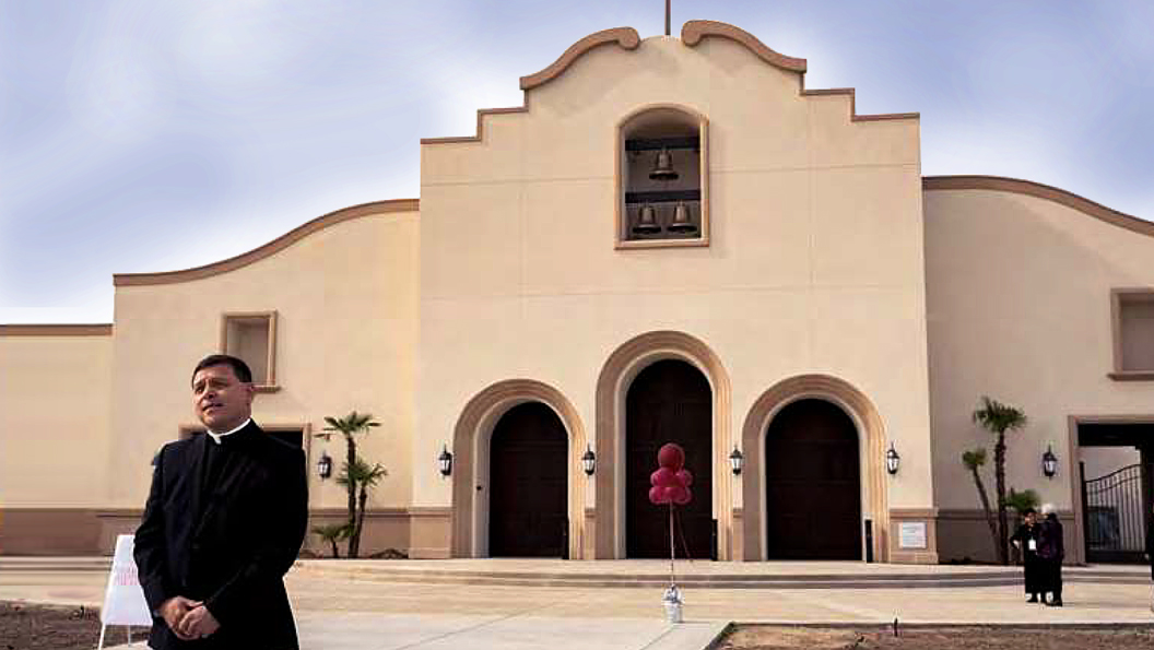 Father Alex Chavez, in front of the completed project