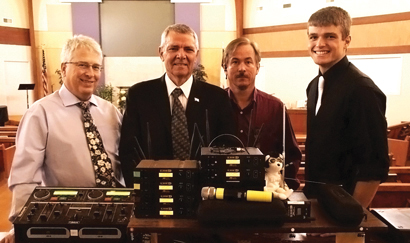 From left, Loren Dryer, Pastor Don Gibson, Tony McKenzie of Action Audio Visual, and Michael Gibson
