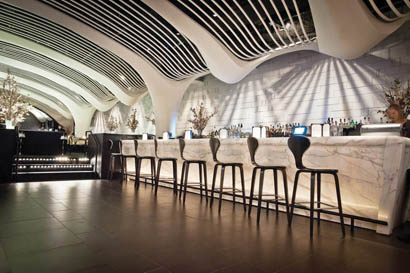 STK steakhouse within the W.R. Grace Building is using Symetrix Jupiter 8 turnkey processors with Symetrix ARC-2e wall panel remotes. Shown here, the main bar.