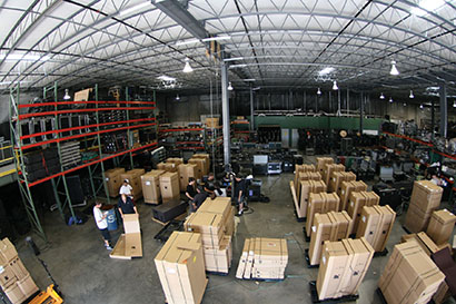 The first half of Onstage Systems’ K1 shipment arrives at the Dallas shop