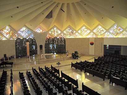 Acoustic treatments and center cluster arrays were not an option in the unique space.