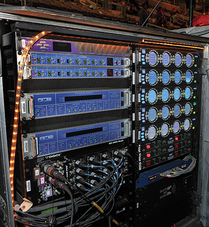 The system rack includes Lake processors, RME MADI and AES routing, an Apogee Big Ben master clock and Cat-5 routing.