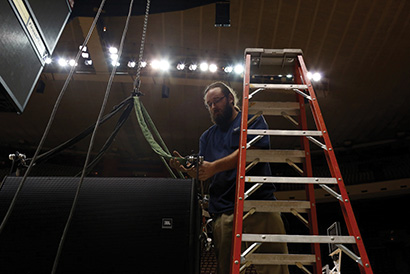 Clayton Hadley prepares the spansets before lifting the subwoofers.