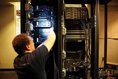Ryan Hall wiring the equipment racks. 