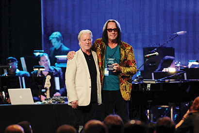 Jeff Salmon of the Les Paul Foundation (pictured left) presented Todd Rundgren (right) with the Les Paul Award. Photo by Tom Galloway/M2M PR