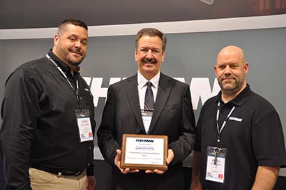 Fishman recently presented Sweetwater with its Outstanding Achievement Award for exceptional sales growth in all product categories, including the TriplePlay Wireless Guitar Controller. Pictured are, from left, Jason Cambra, Fishman COO; Chuck Surack, Sweetwater president; and Kevin White, Fishman business development manager.