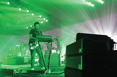 Neon Trees Gearing Up for 2014 Shows with VUE al-8 and al-4 Line Arrays. Pictured here, The VUE on stage with Neon Trees' bassist Branden Campbell