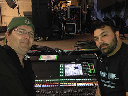 From left, Trivium monitor engineer Mike Babcock with tour manager Joey Brueckmann