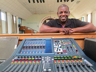 New Testament Church of God pastor “Prince” Chambers and volunteer A/V supervisor Brother Neville Higgins worked with Sound Foundation Ltd.’s Mark Payne on an analog-to-digital upgrade that included a Midas PRO1 console. Pictured here with the console is Higgins.