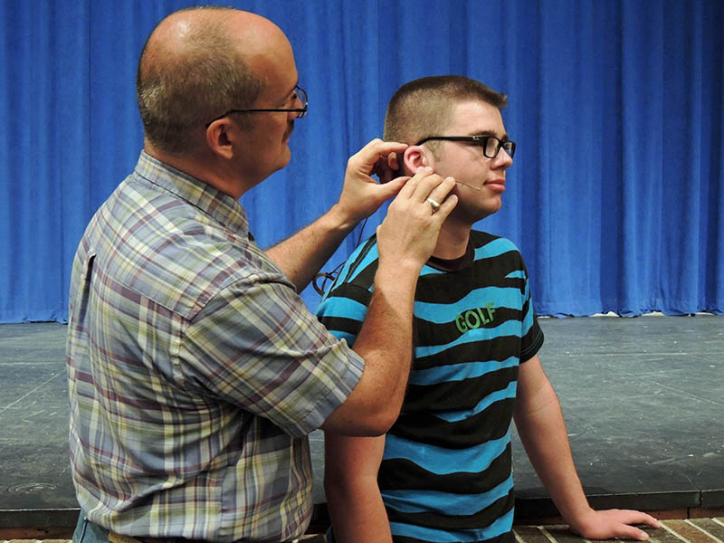 Pryor High School has been relying on Countryman’s E6 earset microphones — both omnidirectional and directional — for the major musical performances it stages every year at the Herchel Avra Performing Arts Center. Pictured here is Jim Bryant, Jr., manager of the Avra PAC, who helps students with the Countryman gear.