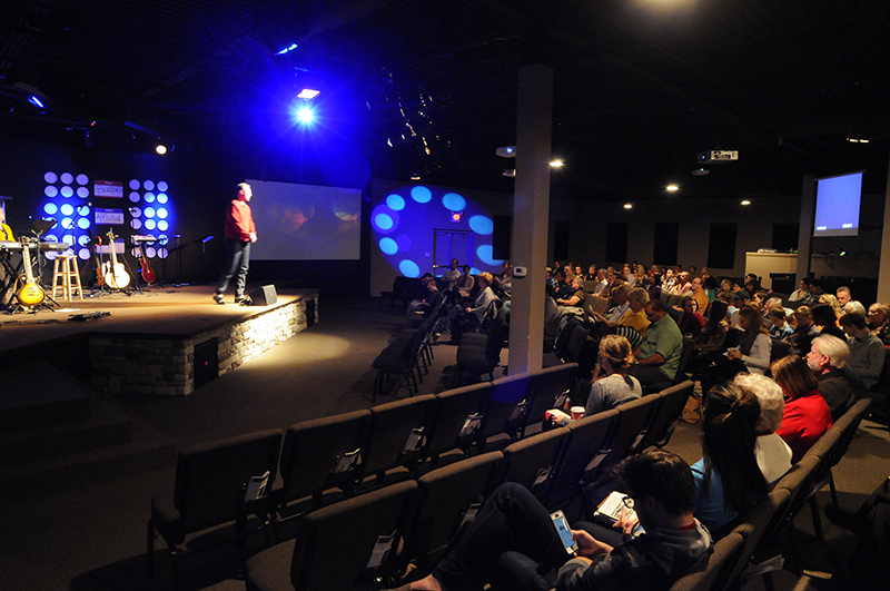 Housed in a shopping center with 1500 square feet of space, the sanctuary was created using carpeting, padded chairs, and an assortment of acoustic panels.