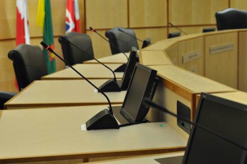 Regina Town Council chambers with Shure DDS 5900 Digital Discussion System using integrated desktop microphones and speakers to enable up to 250 meeting participants to hear and be heard clearly