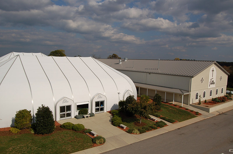 The unique church worship center features stressed membrane structure.