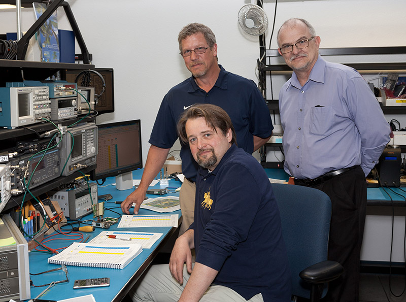 (Top: Lto R) Dean Slotness, Field Service Engineering Manager and Gordon Moore, VP of Sales, Lectrosonics; (Foreground) ART's Simon Griffet Edit