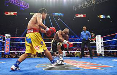 WBA Super World/ WBC/ WBO Welterweight Title: Floyd Mayweather (R) in action vs Manny Pacquiao during fight at MGM Grand Garden Arena. View of referee Kenny Bayless watching. Las Vegas, NV 5/2/2015 CREDIT: Robert Beck (c) Robert Beck /Sports Illustrated/Getty Images