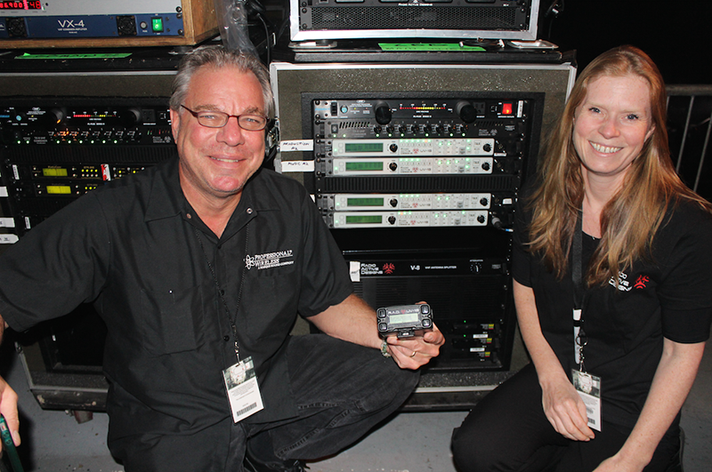James Stoffo, RF coordinator and Sisse Jonassen, wireless intercom systems technician, with a rack of Radio Active Designs UV-1G base stations and belt packs