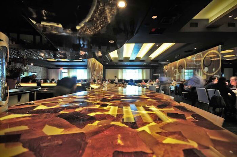 The bar area of the newly renovated Addison, Texas location of Gloria’s Latin Cuisine, featuring immersive AVL sourced through Guitar Center Professional. Photo courtesy of Custom Audio Video Services. © 2015.