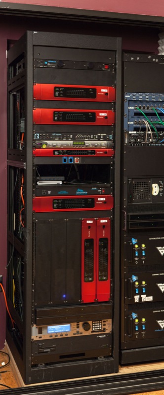 One of the A/V control racks at the Digital Media Commons (DMC) at the James and Anne Duderstadt Center, a part of the University of Michigan (U-M) Library, featuring a number of Focusrite RedNet units. Photo courtesy of Dave Greenspan, University of Michigan. © 2015.