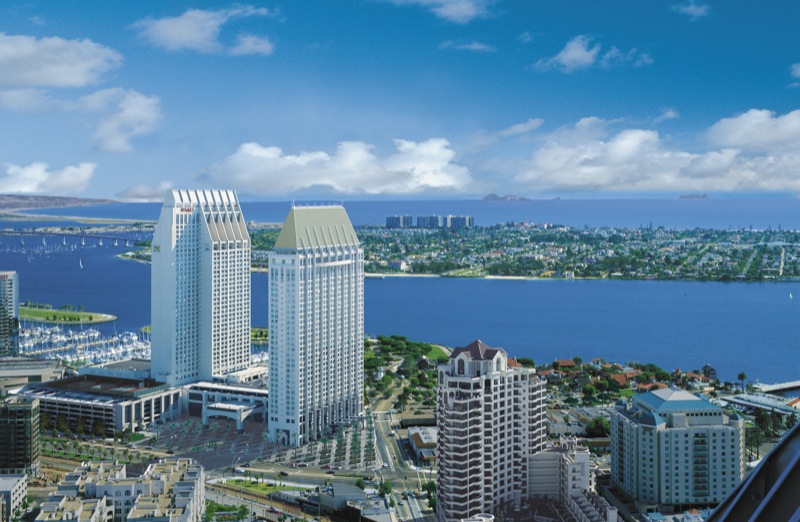 An external view of the Hyatt Grand Manchester’s two towers overlooking San Diego’s waterfront bay (c) Hyatt Corporation