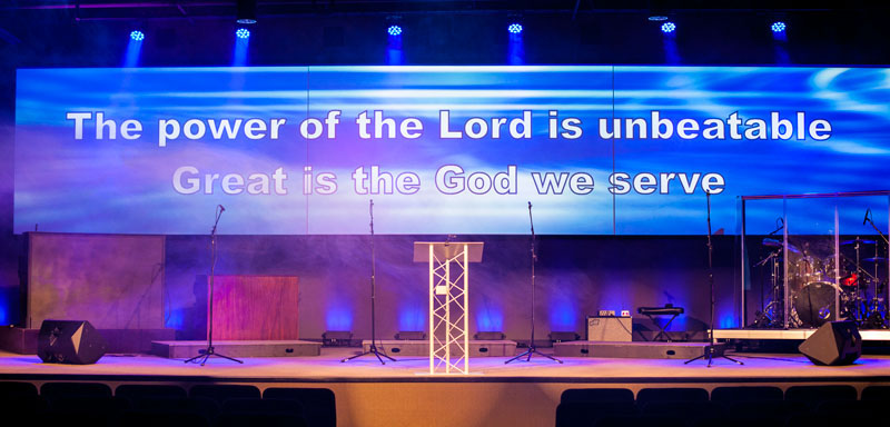 A view of the stage and screen at Koinonia Christian Church in Arlington, TX, featuring a variety of gear sourced through Guitar Center Professional and installed by GC Pro affiliate Featherston Media. Photo courtesy of Featherston Media