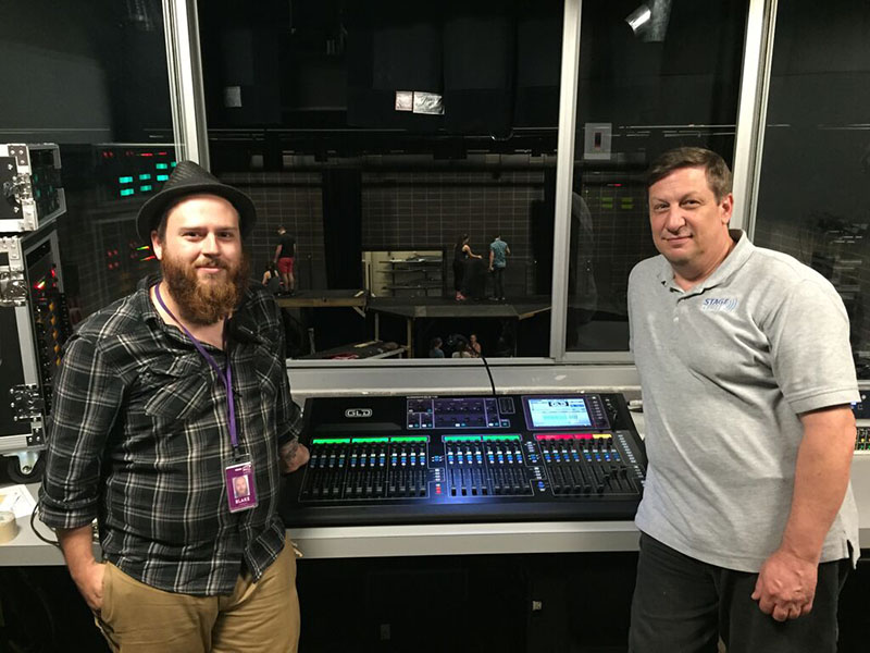 From left, Blake Addyson, Production Supervisor, Long Center and Bill Meste, StageTech, Inc. (right) in Rollins Theatre at the Long Center for the Performing Arts in Austin, Texas. The photo is taken within the elevated booth.
