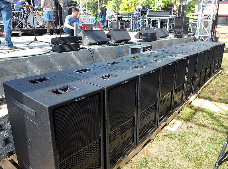 Extensive VUE inventory on stage, a dozen hs-28 subwoofers line the stage.