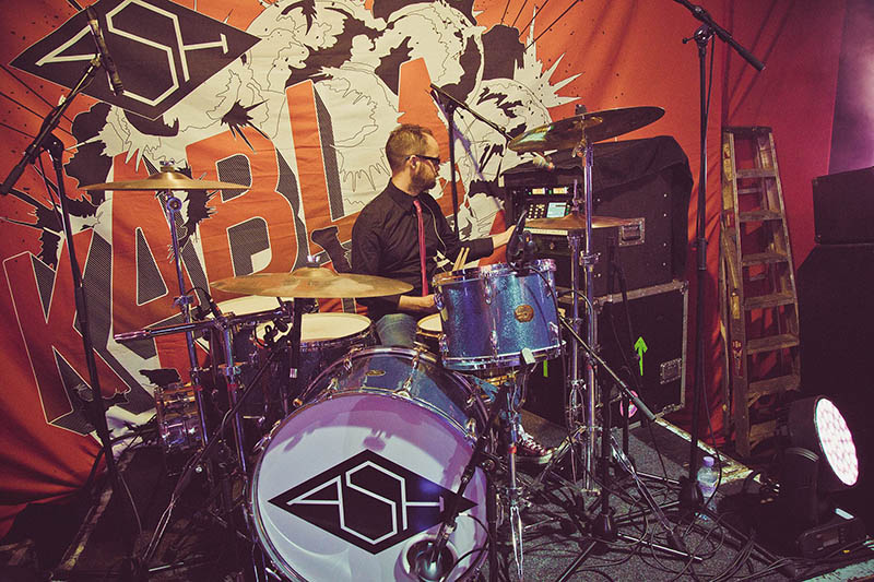 Irish rock band, Ash, is currently on tour supporting their 2015 album, Kablammo , with Allen & Heath’s ultra-compact Qu-Pac digital mixer managing monitor sound. The band’s FOH engineer, Alan “Hagos” Haggarty, and drummer/monitor engineer, Rick McMurray (pictured here), both cited the setup as a significant improvement over the analog status quo.