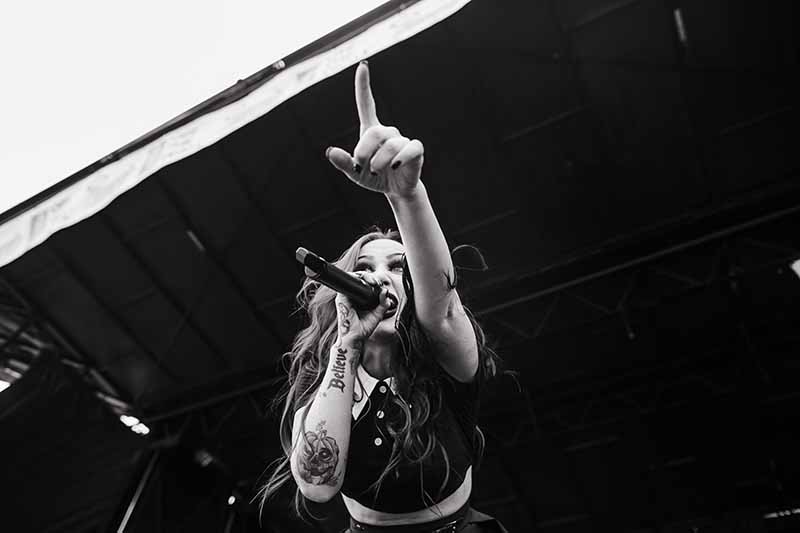 New Years Day lead singer Ashley Costello performs through the evolution D1 wireless while on Vans Warped Tour