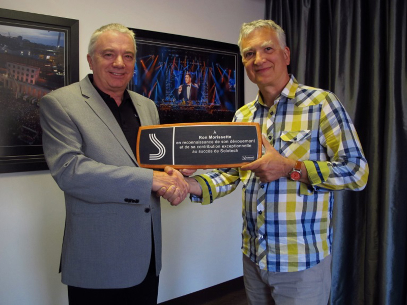 Solotech's Jean Louis Blanchard congratulates Ron Morissette, who has announced that he is retiring.