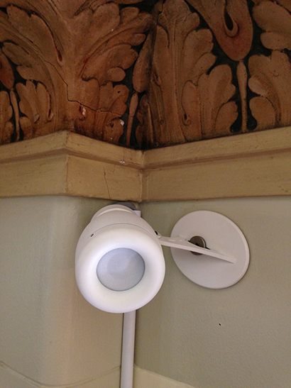 Surface-mounted speakers were the only option as the ceiling and walls were both made of solid concrete. 