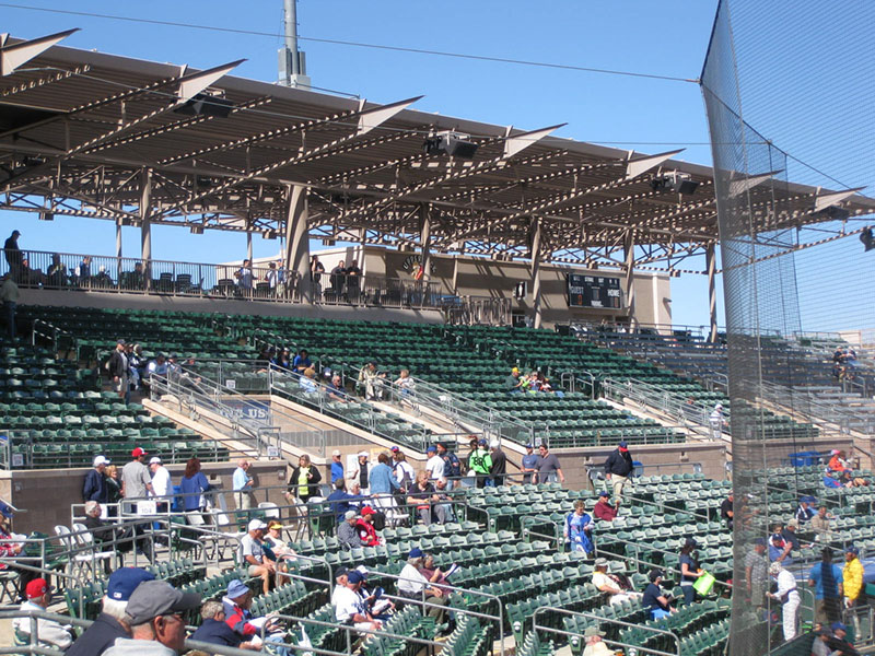 The in-field seats at Mesa's Hohokam Park, featuring EAW loudspeakers hanging from the overhead.