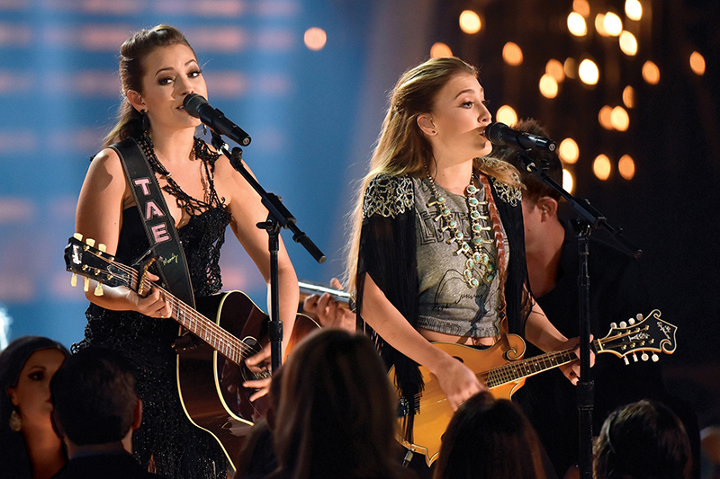 Maddie & Tae (left to right Taylor Dye and Madison Marlow) won the Music video of the year for ‘Girl in a Country Song’ at the 49th Annual CMA Awards on Nov. 4, 2015. They performed using Audio-Technica’s Artist Elite 5000 Series UHF Wireless System and AEW-T5400a Cardioid Condenser Handheld Microphone/Transmitters. Photo by Frederick Breedon/Getty Images.